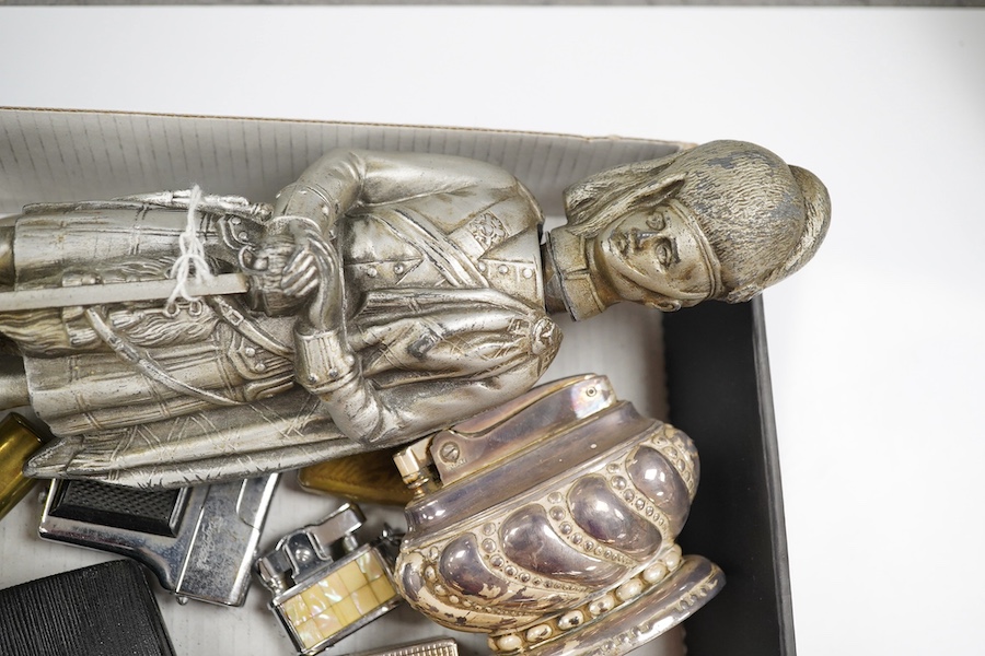 A collection of assorted cigarette lighters, including a large figural lighter, largest 23cm high. Condition - variable